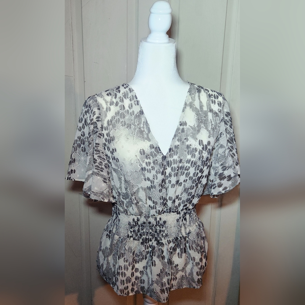 Express black and gray snakeskin print flared elastic waist top.